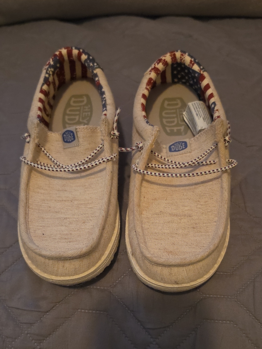 Hey Dude Kids Beige Canvas Slip-On Shoes with Red, White & Blue Lining
